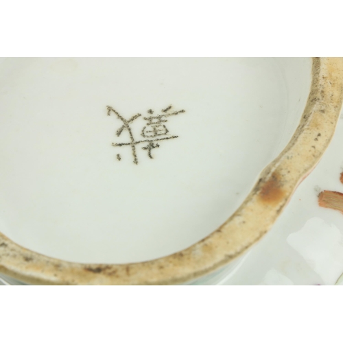 86 - An attractive Japanese oval shaped Dish, the outer side decorated with twelve figures and signed on ... 