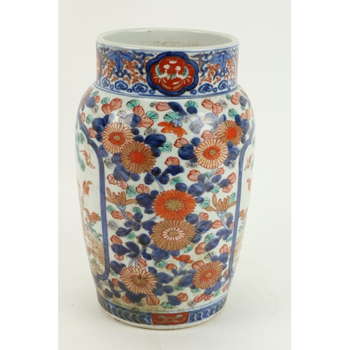 90 - A 19th Century Imari porcelain Vase, the overall floral decoration with two panels, figures in a lan... 