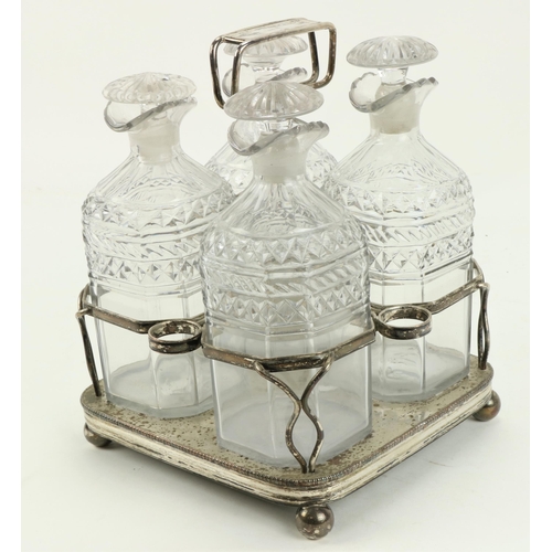 91 - A good early 19th Century silver plated Tantalus, c. 1820, with four cutglass bottles and stoppers, ... 