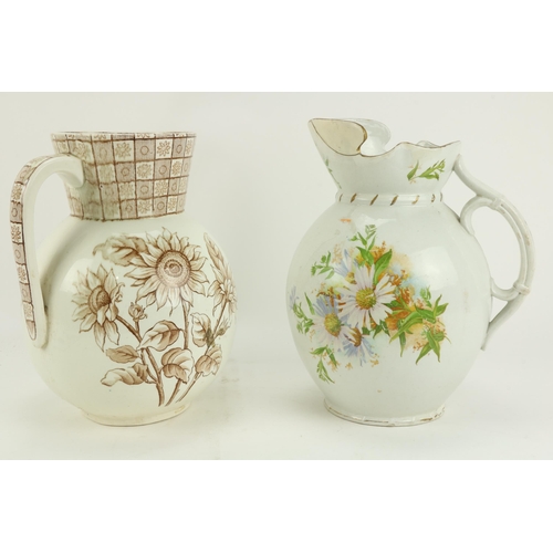 96 - A large Belleek pottery Jug, (dam.); and one other Jug  (2)