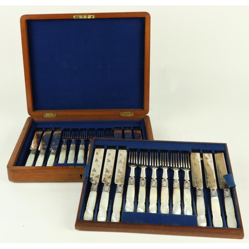 242 - A cased set of 24 mother-o-pearl handled engraved Fruit Knives and Forks, in oak presentation box. (... 