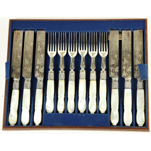 242 - A cased set of 24 mother-o-pearl handled engraved Fruit Knives and Forks, in oak presentation box. (... 