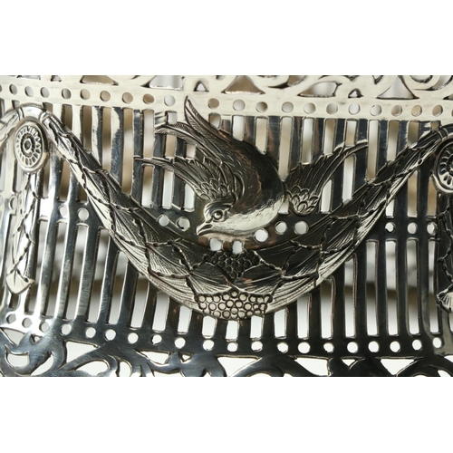 663 - An Irish pierced silver Dish Ring, Dublin 1918, decorated with different birds above leaf swags, 8' ... 