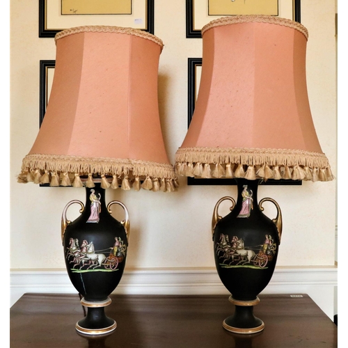 873 - A good pair of Grecian style porcelain black ground vase shaped Table Lamps, each with two leaf scro... 