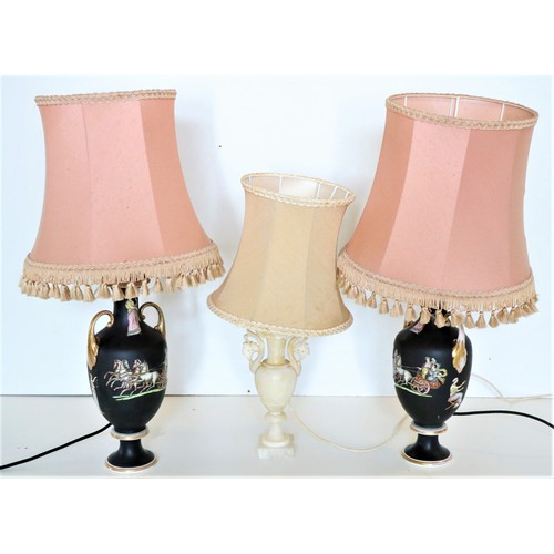 873 - A good pair of Grecian style porcelain black ground vase shaped Table Lamps, each with two leaf scro... 