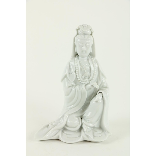 290 - An early blanc-de-chine Chinese porcelain Figure, Quan Yin, she kneeling on one knee holding a scrol... 