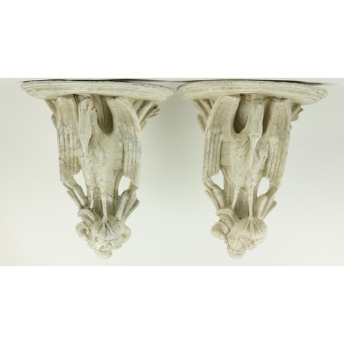 371 - A pair of unusual moulded plaster Wall Brackets, each with a demi-lune shelf supported by a stork, 1... 