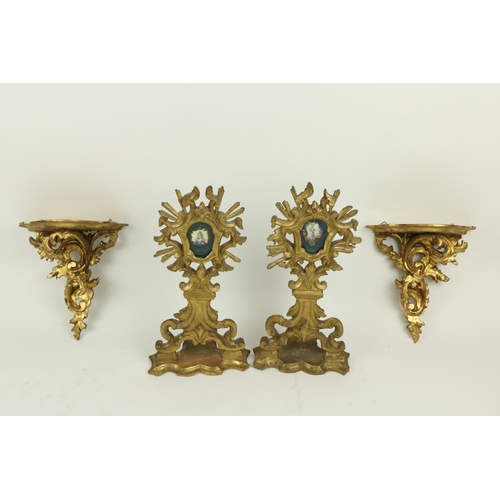 372 - A pair of late 18th Century carved giltwood Reliquary Stands, with shield shaped apertures, now with... 