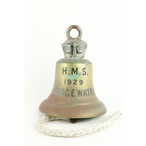 386 - A heavy bronze Bell, with cast iron ring supports, inscribed H.M.S., Bridgewater 1929, 14