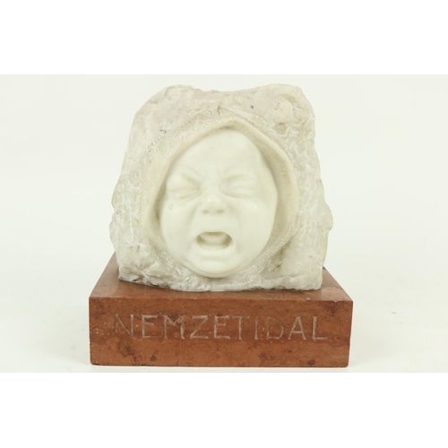 404 - A carved Carrara Head Study of a crying Infant, on rectangular rouge marble plinth; the plinth inscr... 