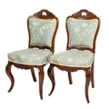A fine set of 12 Victorian carved rosewood Dining Chairs, each cartouche shaped padded back with asy... 