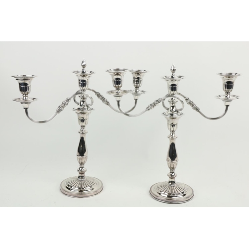 615 - A good pair of Sheffield plated two branch - three light Candelabra, with scrolling reeded arms, 15 ... 