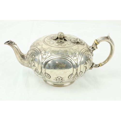 660 - A Victorian silver pumpkin shaped Teapot, London 1868, by ML & HL, embossed with scrolls and fol... 