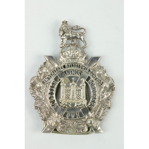 728 - Military: An attractive pierced silver Kings Own Scottish Borders Badge, now with small attached sta... 