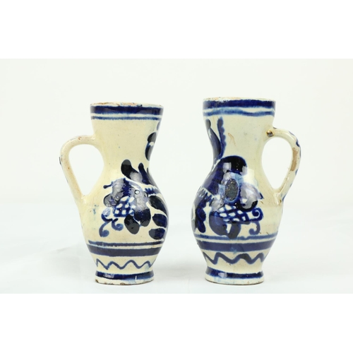 850 - A pair of late 17th / early 18th Century London Delft blue and white water/wine Cruets, each approx.... 