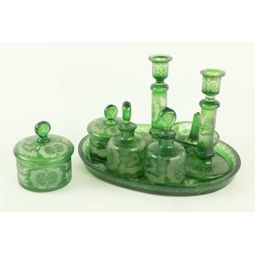 891 - An unusual Bohemian 8 piece green glass etched Dressing Table Set, comprising pair of Candlesticks, ... 