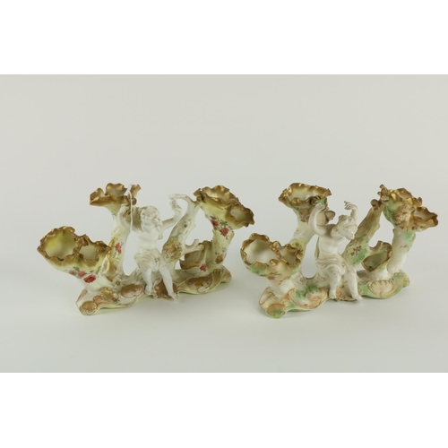 932 - A good pair of 19th Century Moore Brothers six compartment cherub Table Vases, Reg. No: 190756, each... 