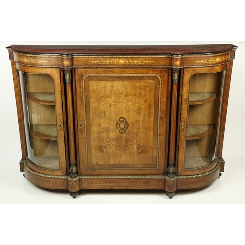 100 - A good Victorian walnut and marquetry inlaid Credenza, with brass mounts, the centre inlaid panel do... 