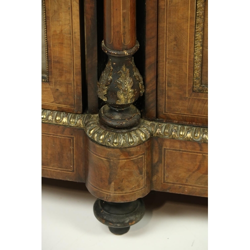 100 - A good Victorian walnut and marquetry inlaid Credenza, with brass mounts, the centre inlaid panel do... 