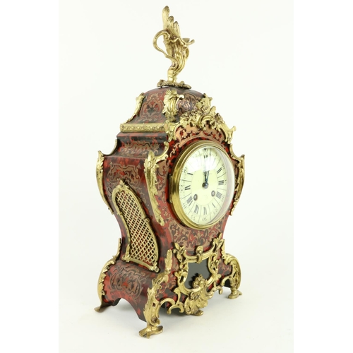 122 - A fine quality French Mantel Clock, with boulle case and overall ormolu rococo mounts with pierced d... 