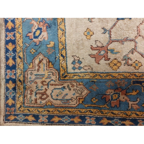 134 - A Turkish Ushak hand knotted wool Carpet c. 1920's, the fawn ground with all over stylized flowers w... 