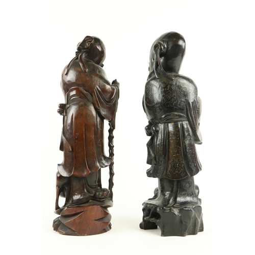 170 - A Chinese carved cherrywood Figure, of Shou Xing (God of Longevity) leaning on the 