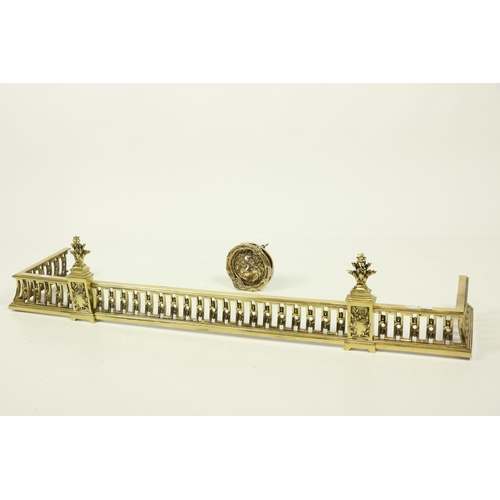 177 - A modern pierced brass Fender, with leaf fruit finials on a concave pierced frieze; together with a ... 