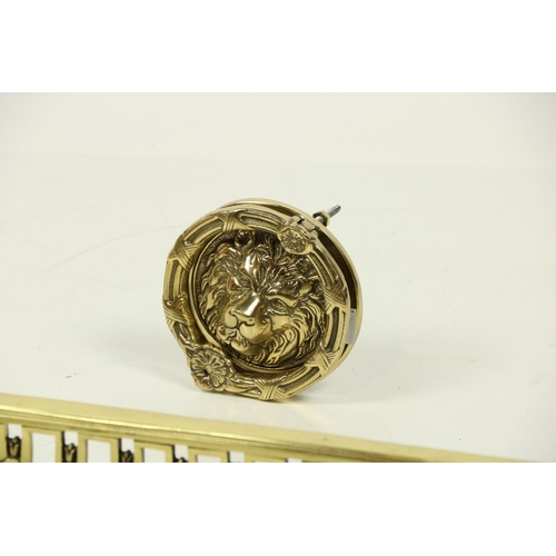 177 - A modern pierced brass Fender, with leaf fruit finials on a concave pierced frieze; together with a ... 