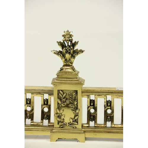 177 - A modern pierced brass Fender, with leaf fruit finials on a concave pierced frieze; together with a ... 