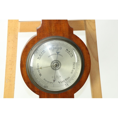 225 - A late 19th Century mahogany Wheel Barometer, by Negretti & Zambra, with divided pediment over t... 