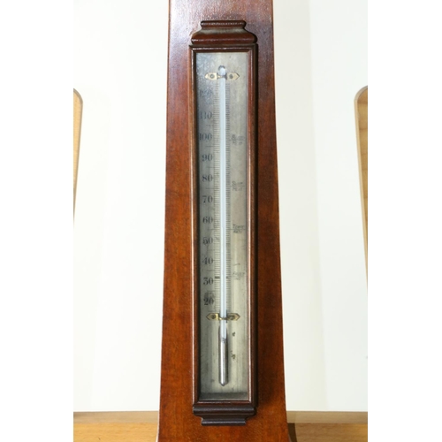 225 - A late 19th Century mahogany Wheel Barometer, by Negretti & Zambra, with divided pediment over t... 