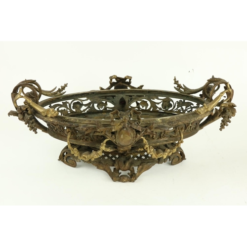 250 - A good pair of French bronze and gilt bronze oval Jardinières, each in the rococo style with scrolli... 