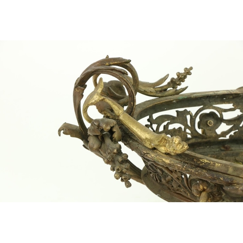 250 - A good pair of French bronze and gilt bronze oval Jardinières, each in the rococo style with scrolli... 