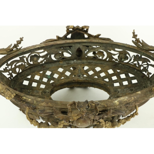 250 - A good pair of French bronze and gilt bronze oval Jardinières, each in the rococo style with scrolli... 