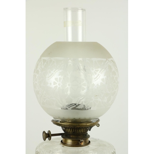 256 - A good telescopic brass and cutglass Oil Lamp, with cutglass reservoir and etched bulbous glass shad... 