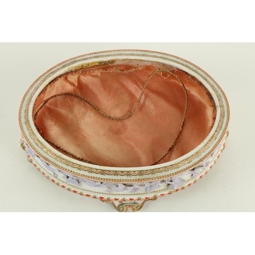 260 - A Continental oval porcelain Jewellery Casket and cover, the cover decorated with trailing flowers a... 