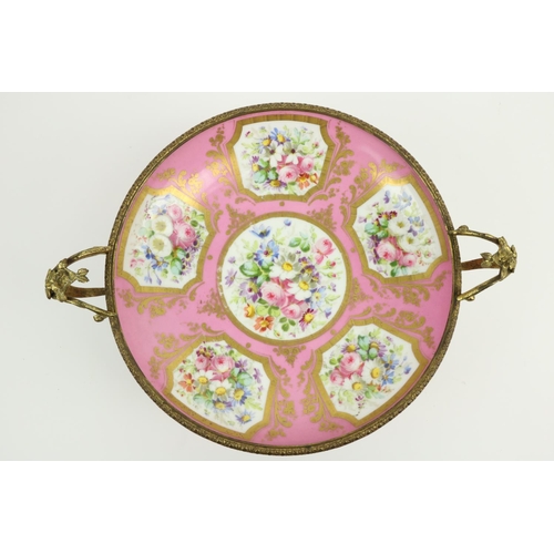 261 - A very attractive  pink ground floral decorated Serves style porcelain Dish, on ornate rococo style ... 