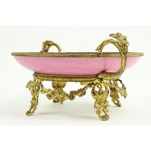 261 - A very attractive  pink ground floral decorated Serves style porcelain Dish, on ornate rococo style ... 