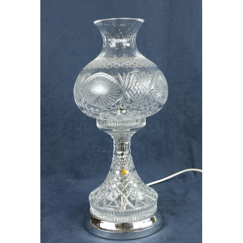 269 - A Tipperary crystal Table Lamp, with bulbous shade on circular stainless base, 17