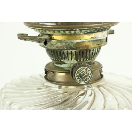 270 - An unusual cutglass Oil Lamp, with baluster shaped facet cut stem and reeded glass reservoir support... 