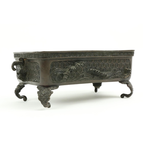 282 - A Japanese rectangular bronze 'Rabbit' pattern Bonsai Table top Planter, with Greek key edge and two... 