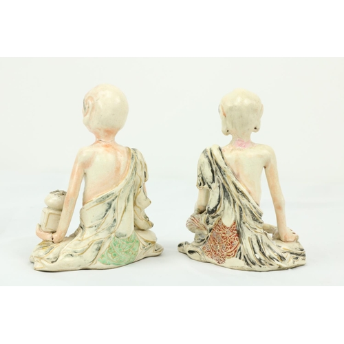 294 - A pair of 19th Century Japanese porcelain Figures, of seated Ascetic Shaman with coloured highlights... 