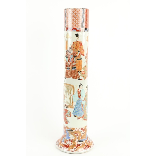 306 - A tall Japanese Imari Vase, of cylindrical form, decorated with figures and warriors on a circular d... 