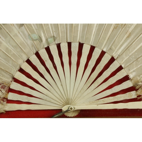 353 - An attractive floral painted silk Fan, in arched case, 29