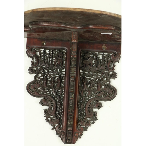 358 - A rare pair of carved and pierced Chinese cherrywood Wall Brackets, (one as is) each carved with fig... 