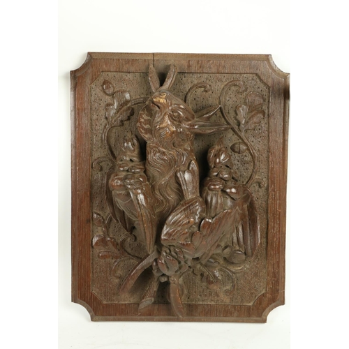 363 - A carved oak Panel, depicting hanging dead game in high relief 15 1/2