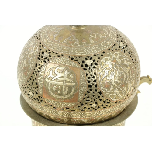 376 - A late 19th Century Islamic brass, copper and silver Incense Burner, with pierced dome cover with Is... 