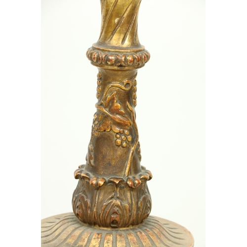 410 - A giltwood Georgian style Torchere, with floral decoration and drapes on a triform base with paw fee... 