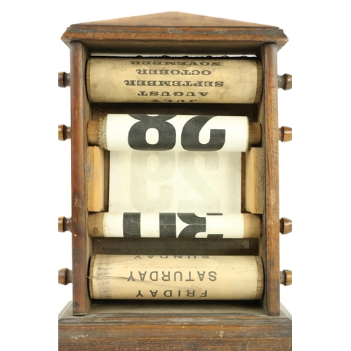 444 - A desk top Edwardian roller perpetual Calendar, in oak case, 10