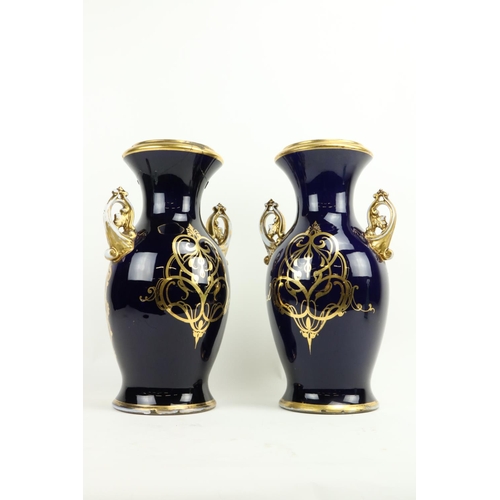 466 - An attractive pair of 19th Century French dark blue and parcel gilt porcelain Vases, each with two h... 